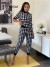 Conjunto Deportivo Mujer Cuadros Blanco Negro | 7,63 $ | OKKO MODE
