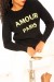Sudadera negra cuello redondo con estampado AMOUR PARIS | 10,92 $ | OKKO MODE