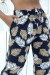 Pantalón negro elástico con estampado de hojas - Talla y tobillos ajustables | 6,69 $ | OKKO MODE