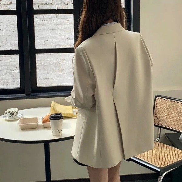 Blazer mujer reverso oversize, abrigo amplio monocromático.