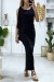 Vestido negro con volante en una manga y detalle dorado en el cuello | 6,83 $ | OKKO MODE